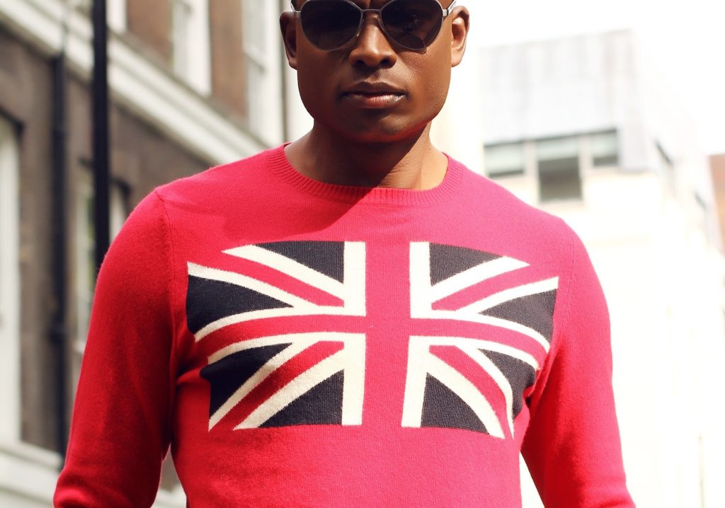 man wearing red top with union jack