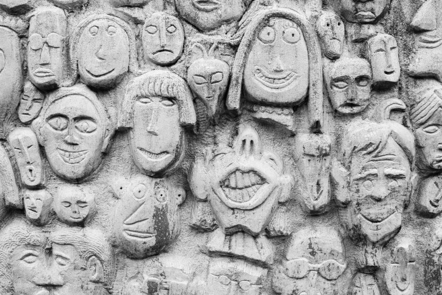 Faces carved into a surface