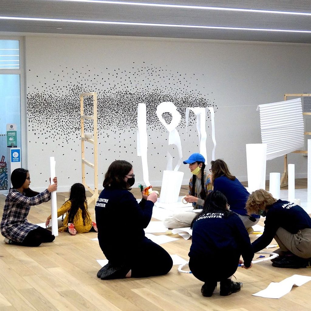 People in a gallery participating in workshop