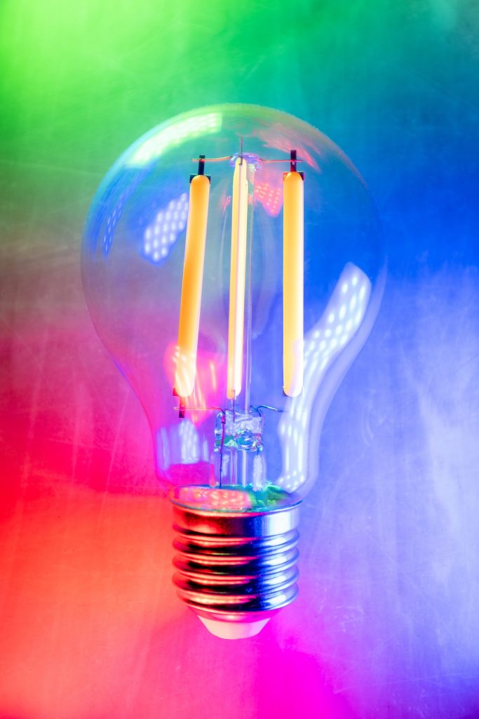 lightbulb with a colourful background