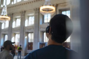 A person wearing a headset in a museum