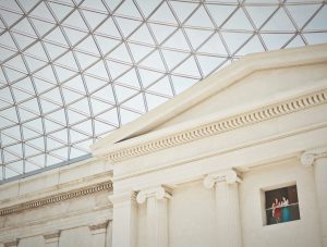 Two people gazing inside a museum space