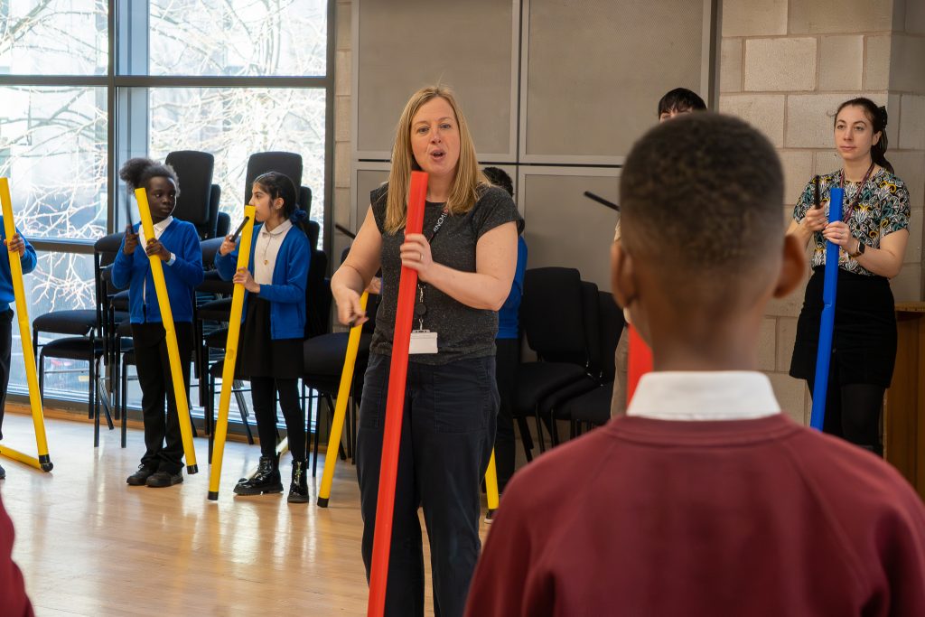 Teacher and children with instruments