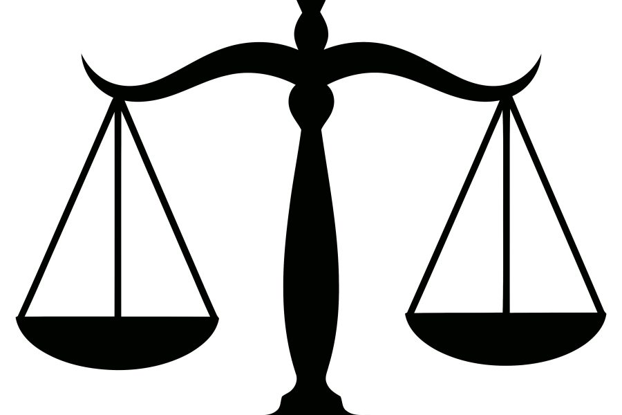 A white background with a black silhouette of classic balance scales