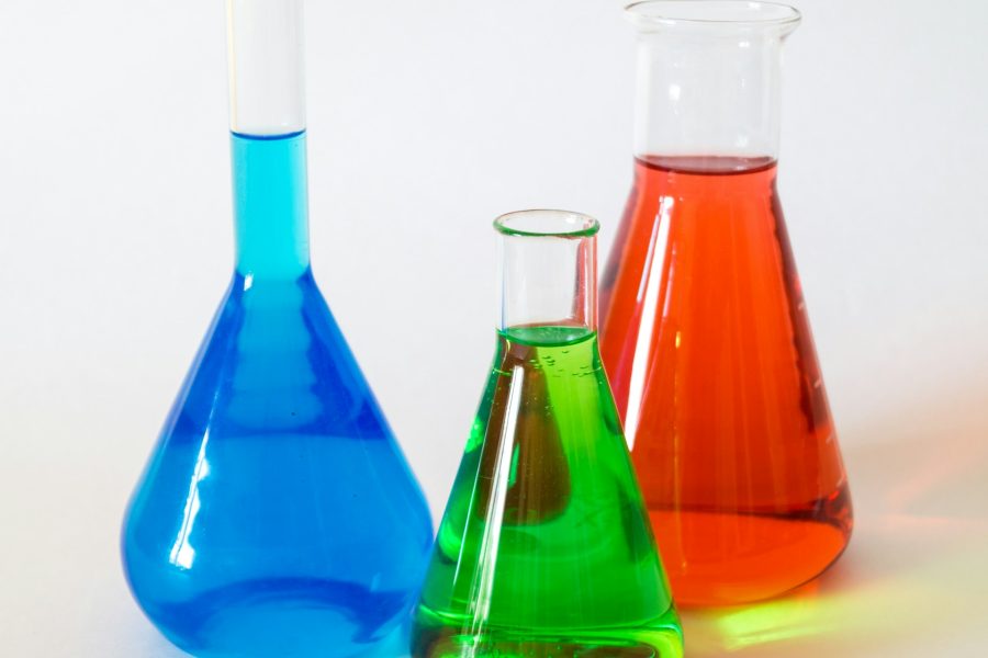 Conical flasks with different coloured liquid